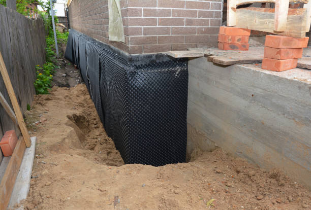 Happy homeowners after waterproofing job in Dayton
